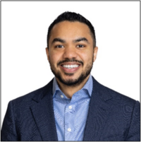 Man in suit jacket poses for professional headshot