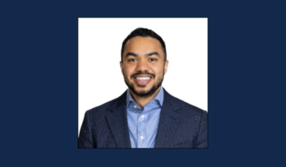 Man in suit jacket poses for professional headshot